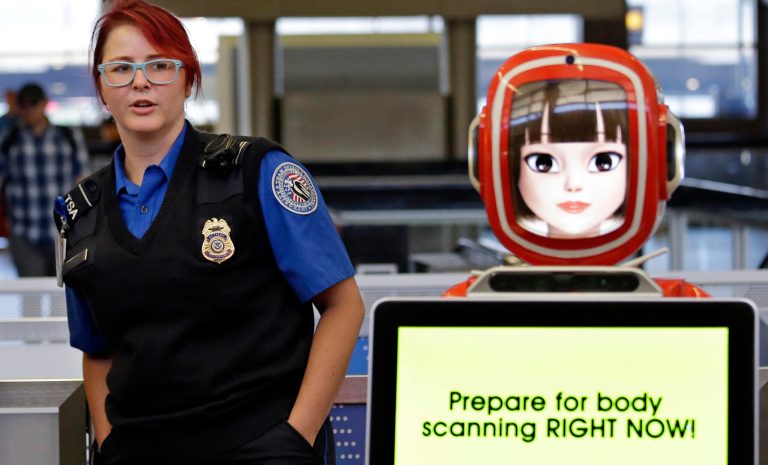 In 2016, a total of 3,391 firearms were seized from airport passengers' carry-on bags. If this year's rate continues through December, TSA should expect to find 3,722 guns by the end of the year. A TSA officer looks over at a robot providing tips for passengers on getting through security faster during a pilot project July 11 at Seattle-Tacoma International Airport in SeaTac, Wash. (AP Photo/Elaine Thompson)