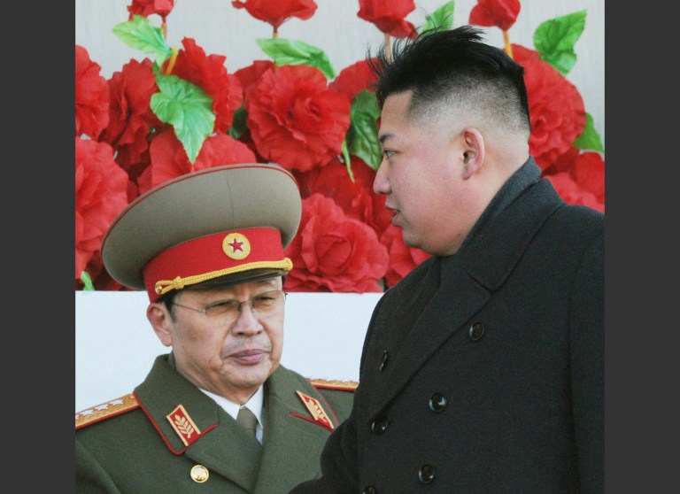 North Korean leader Kim Jong Un walks past his uncle Jang Song Thaek, left, after reviewing a parade of thousands of soldiers commemorating the 70th birthday of the late Kim Jong Il, in Pyongyang, North Korea, in February 2012. (AP Photo/Kyodo News, File)ÃÂ 