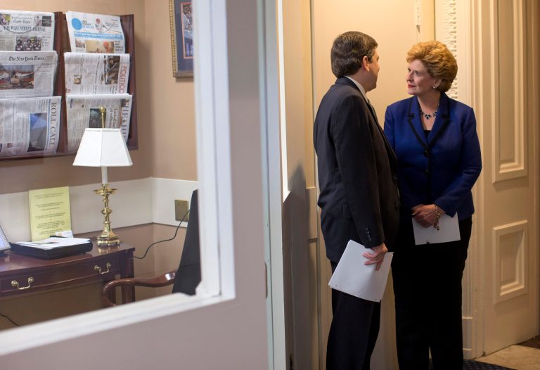   Sen. Debbie Stabenow, D-Mich., right, talks with Sen. Mark Begich, D-Alaska, before a news conference on Capitol Hill in Washington, Wednesday, Dec. 5, 2012, where they discussed the debate on tax rates and the fiscal cliff. (AP Photo/ Evan Vucci)  