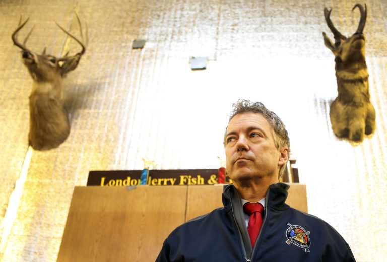 U.S. Sen. Rand Paul, R-Ky., waits to be introduced to members of the Londonderry Fish and Game Club, Wednesday, Jan. 14, 2015, in Litchfield, N.H. (AP Photo/Jim Cole)