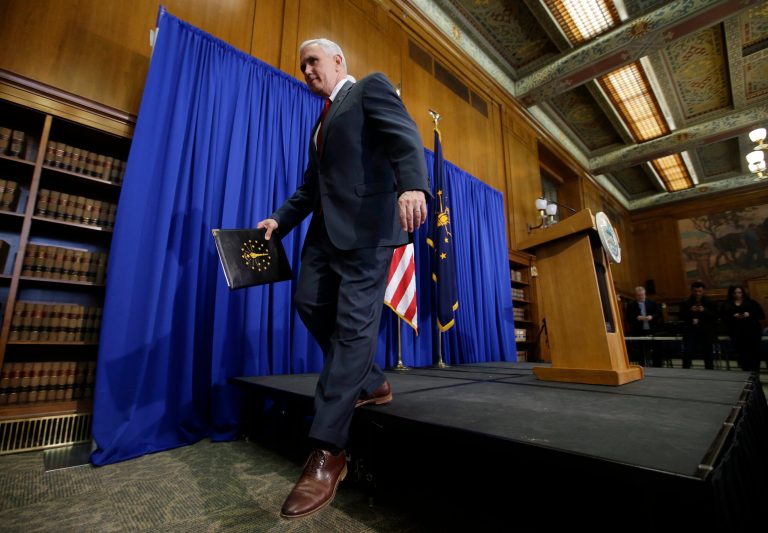 In this March 31, 2015 file photo, Indiana Gov. Mike Pence steps off the podium after discussing the state's new religious-freedom law in Indianapolis. Tourism agencies in Indianapolis and Fort Wayne are rolling out campaigns to tout the fact that 