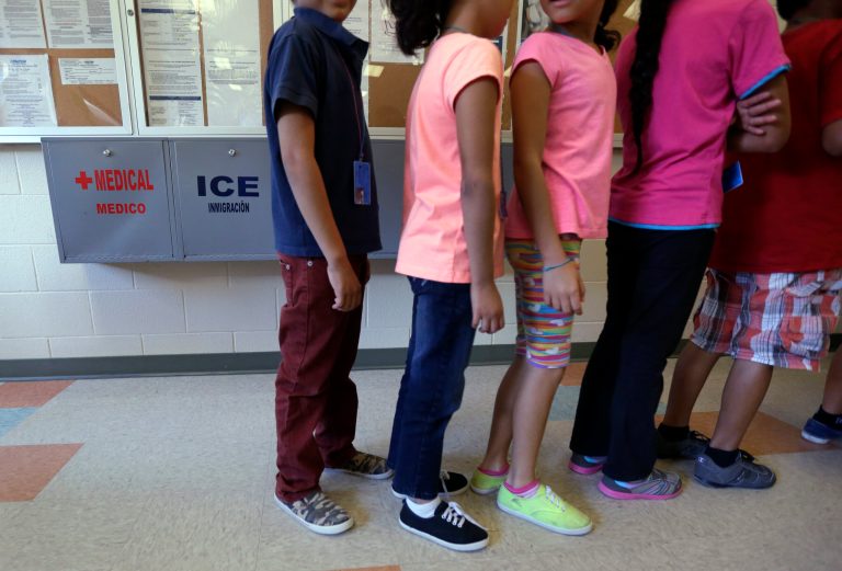 In this Sept. 10, 2014 file photo, detained immigrant children line up in the cafeteria at the Karnes County Residential Center, a temporary home for immigrant women and children detained at the border, in Karnes City, Texas. (AP Photo/Eric Gay, File)