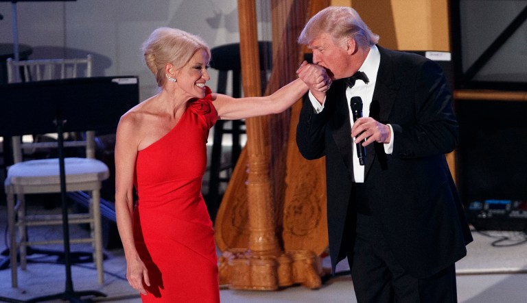 President-elect Donald Trump, right, kisses the hand of Kellyanne Conway, his campaign manager, during a VIP reception and dinner with donors, Thursday, Jan. 19, 2017, in Washington. (AP Photo/Evan Vucci)