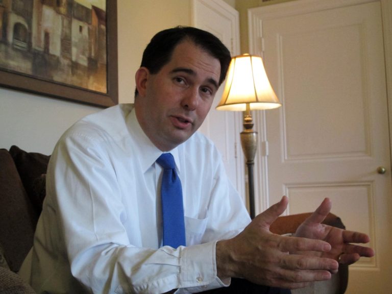 Republican Gov. Scott Walker declined to answer questions Monday about a probe intoÃÂ electoral law violations during Wisconsin's gubernatorial recall election last year. (AP/Scott Bauer)