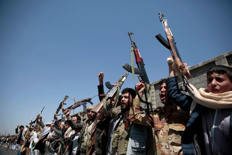 Tribesmen loyal to Houthi rebels hold their weapons as they chant slogans during a gathering aimed at mobilizing more fighters into battlefronts in several Yemeni cities, in Sanaa, Yemen. (AP Photo/Hani Mohammed, File)
