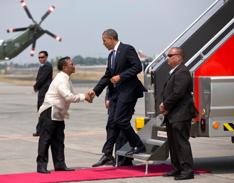 President Obama is greeted by Jejomar C. Binay, Vice President of the Philippines , as he arrives on Air Force One at Ninoy Aquino International Airport at suburban Pasay city outside of Manila, Philippines, Monday, April 28, 2014. (AP Photo/Carolyn Kaster)