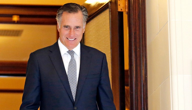 A new ad brings back popular lines of attack that were used during Mitt Romney's run for the White House in the 2012 election cycle, accusing Romney of changing his position on key issues important to Republican primary voters. (AP Photo/Rick Bowmer)