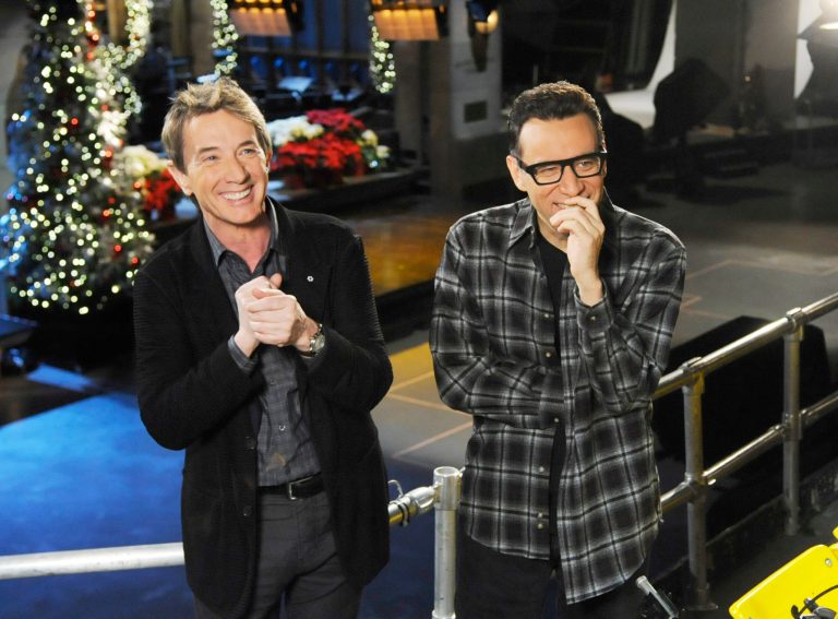   This Dec. 11, 2012 photo released by NBC shows Martin Short, left, with cast member Fred Armisen on the set of 