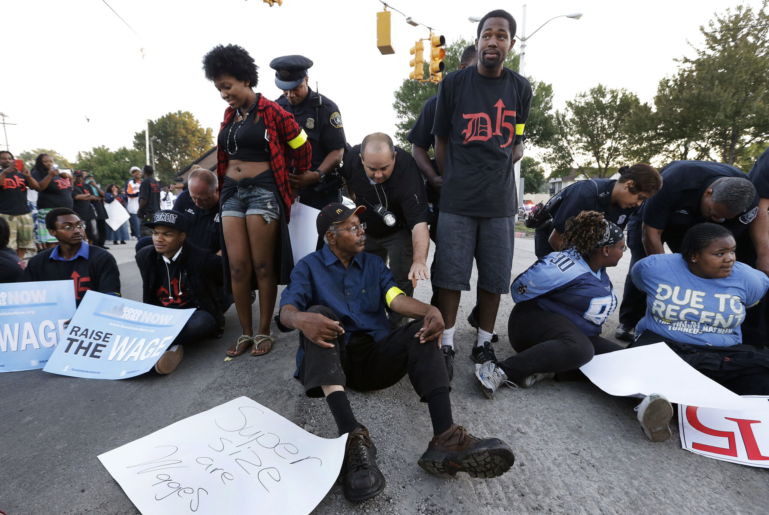 Police handcuff some Detroit fast-food protesters