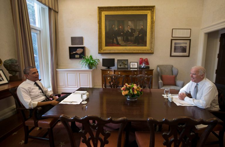 President Barack Obama and Vice President Joe Biden talk during a photo-op as they meet for lunch in the Private Dining Room of the White House in Washington, Wednesday, Jan. 8, 2014. (AP Photo/Carolyn Kaster)