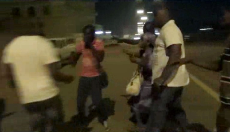 In this image taken from video from AP Television, plain-clothed policemen leading people away near the Splendid Hotel, Friday, Jan. 15, 2016, in Ouagadougou, Burkina Faso. (AP Television via AP)