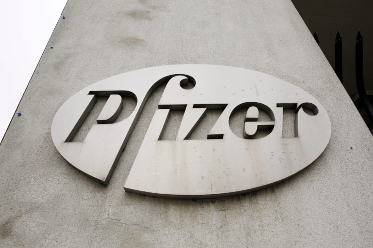 In this May 4, 2014 photo, the Pfizer logo is displayed on the exterior of a former Pfizer factory  in the Brooklyn borough of New York. Pfizer says it does not intend to make a takeover offer for British drugmaker AstraZeneca. The Monday, May 26, 2014 announcement comes a week after AstraZeneca's board rejected a proposed $119 billion buyout offer from Pfizer, the world's second-biggest drugmaker by revenue. (AP Photo/Mark Lennihan, File)