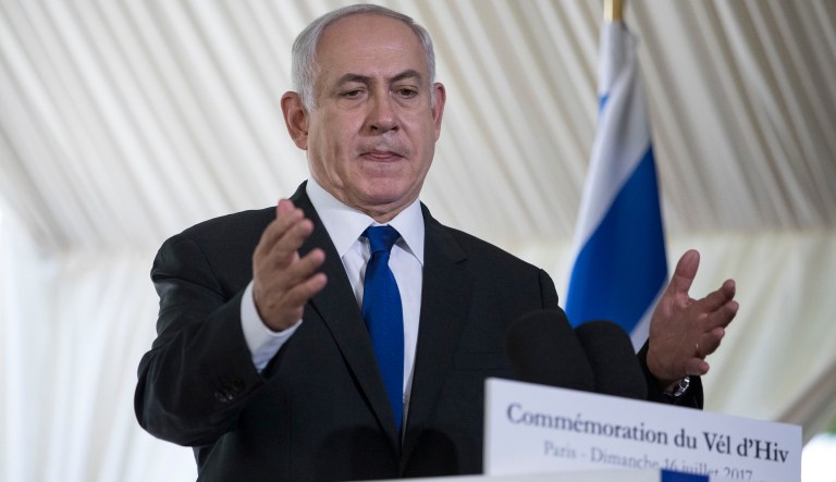 Israeli Prime Minister Benjamin Netanyahu gestures as he delivers a speech during a ceremony commemorating the 75nd anniversary of the Vel d'Hiv roundup, Sunday, July 16, 2017 in Paris. (AP Photo/Kamil Zihnioglu, Pool)