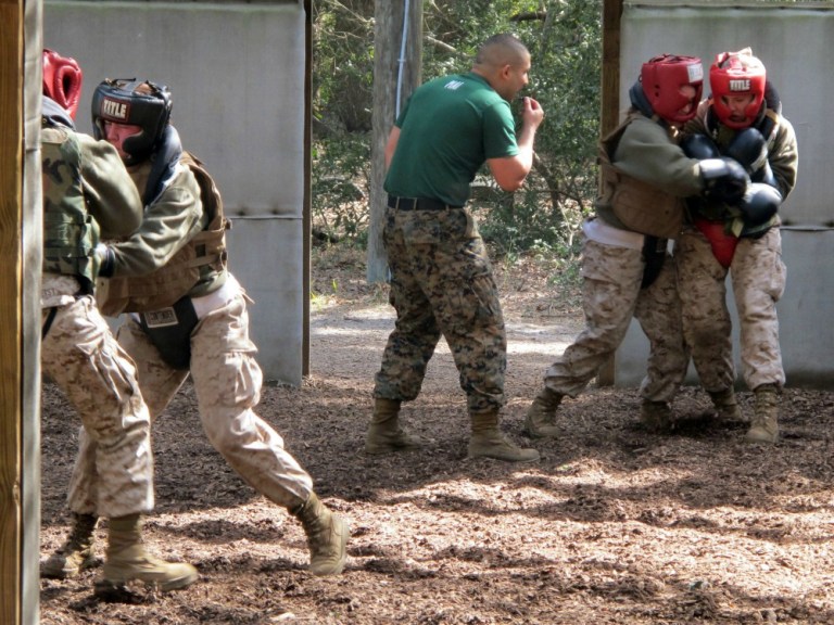 In this Feb. 21, 2013 photo, female recruits box during training at the Marine Corps Training Depot on Parris Island, S.C. Brig Gen. Loretta Reynolds, the first female general in charge of Parris Island's basic training, says she is confident that women in the Corps will do well in combat, if need be. (AP Photo/Bruce Smith)