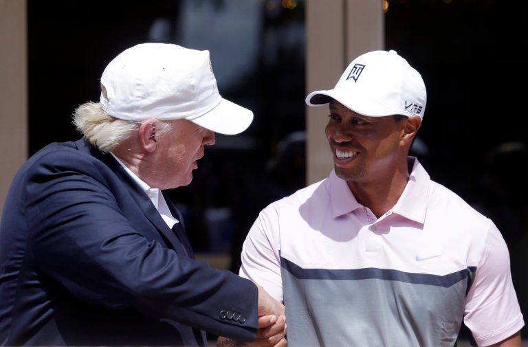 Trump will golf with Tiger Woods at his Trump International Golf Club in West Palm Beach, Fla., Friday. (AP Photo/Wilfredo Lee)
