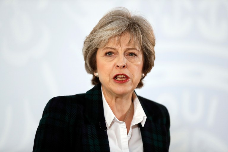 British Prime Minister Theresa May says Britain is committed to free trade and globalization. (AP Photo/Kirsty Wigglesworth, pool)