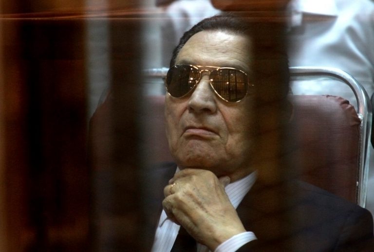 FILE - In this Saturday, April 26, 2014 file photo, ousted Egyptian President Hosni Mubarak attends a hearing in his retrial over charges of failing to stop killings of protesters during the 2011 uprising that led to his downfall, in the  Police Academy-turned-court in the outskirts of Cairo, Egypt.  Mubarak has denied Wednesday that he ordered killing of protesters during his first lengthy speech in court as his retrial in failing to stop deaths of protesters is drawing to an end. (AP Photo/Tarek el Gabbas, File)