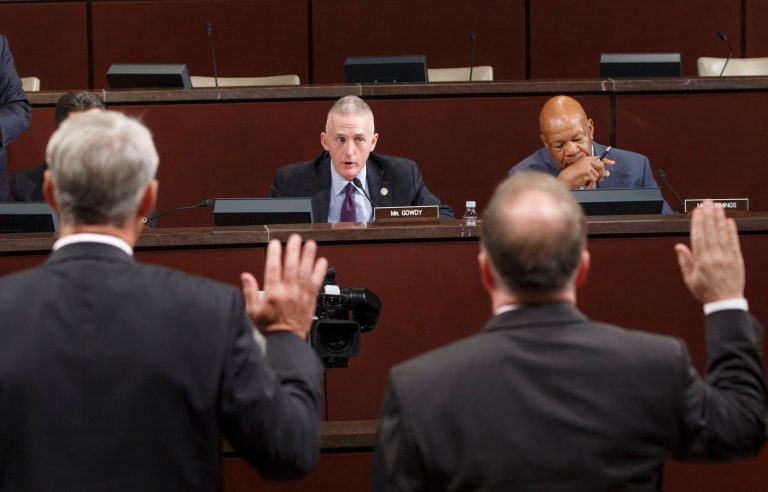 House Select Committee on Benghazi, Chairman Trey Gowdy, R-S.C., center, joined at right by Rep. Elijah Cummings, D-Md., swears in witnesses as the panel investigates the 2012 attacks on the U.S. consulate in Benghazi, Libya, where a violent mob killed four Americans, including Ambassador Christopher Stevens, on Capitol Hill in Washington, Wednesday, Sept. 17, 2014. (AP Photo/J. Scott Applewhite)