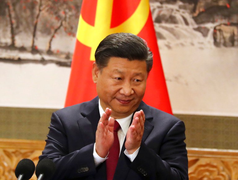FILE - In this Oct 25, 2017, file photo, Chinese President Xi Jinping claps while addressing the media as he introduces new members of the Politburo Standing Committee at Beijing's Great Hall of the People. On a proposal made public Sunday, Feb. 25, 2018, China's ruling Communist Party proposes removing a limit of two consecutive terms for the president and vice president.