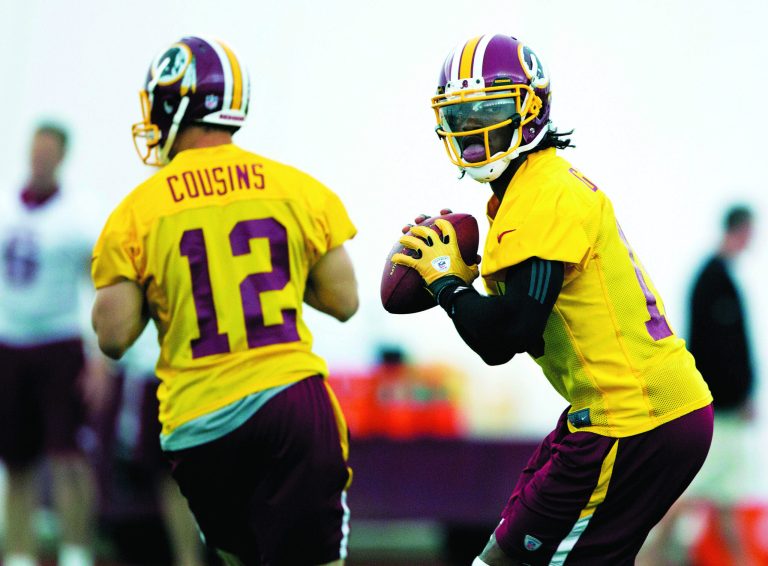 Evan Vucci/AP
Washington Redskins rookie quarterback Robert Griffin III went 5-for-8 for 49 yards against the Chicago Bears on Saturday.