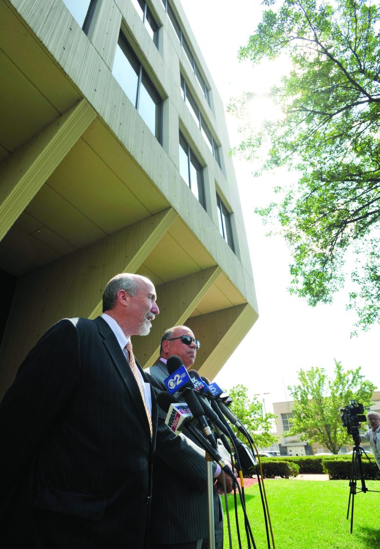 Joel Brodsky left, and Joe Lopez, right, defense attorneys for former Bolingbrook, Ill., police officer Drew Peterson, speak to the media outside the Will County Courthouse in Joliet, Ill., Monday, Aug. 27, 2012, during a break in Peterson's murder trial. The judge in the case rejected a request by the defense to acquit Peterson after prosecutors rested Monday. Peterson has pleaded not guilty to first-degree murder in the 2004 death of his third wife, Kathleen Savio. (AP Photo/Paul Beaty)