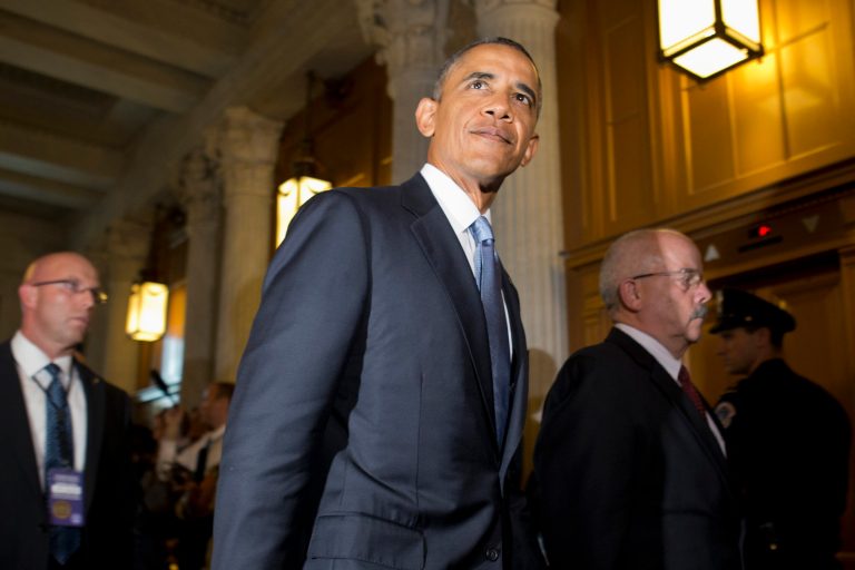 President Obama, accompanied by Senate Sergeant at Arms and Doorkeeper Terrance Gainer, right, leaves a meeting with congressional Republicans on Capitol Hill on Tuesday. (AP/Jacquelyn Martin)