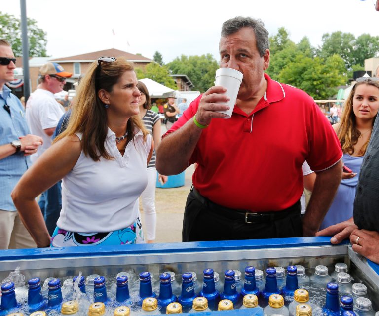 Republican presidential candidate, New Jersey Gov. Chris Christie tries a cold beer with his wife Mary Pat at the Iowa State Fair Saturday, Aug. 22, 2015, in Des Moines, Iowa. (AP Photo/Paul Sancya)