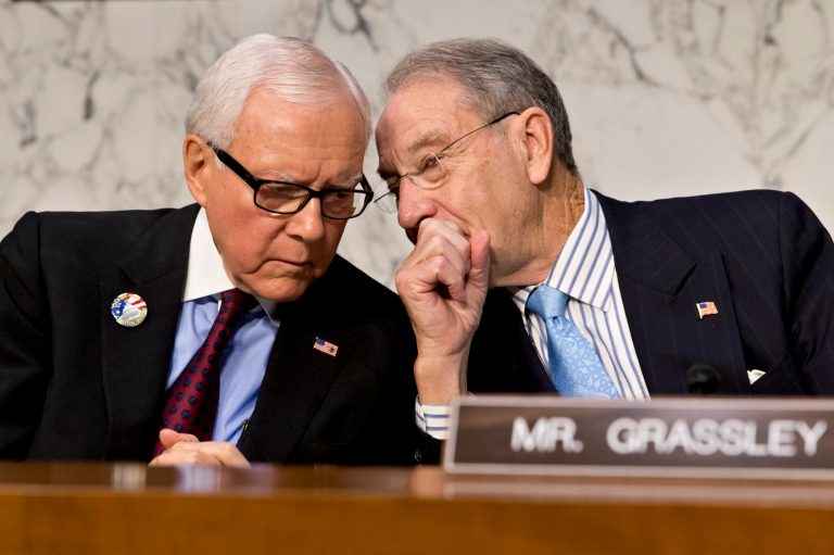 Sens. Orrin Hatch, R-Utah, left, and Chuck Grassley, R-Iowa, released some preliminary numbers of people who have enrolled in the new health care exchanges.ÃÂ (AP/J. Scott Applewhite)