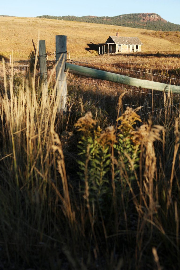 In this undated photo, the old Deerfield school sits unoccupied on private land in the high prairie in the middle of the Black Hills, near Deerfield Lake, S.D. Pe'Sla, an area in the Black Hills that is sacred to the Sioux, is part of millions of acres of land that was taken from Native Americans by the federal government in the 1800s. The Oglala Sioux Tribal Council next week plans to discuss whether to reopen negotiations with the federal government over compensation for the taking of the Black Hills in the 1800s. (AP Photo/Rapid City Journal, Benjamin Brayfield)