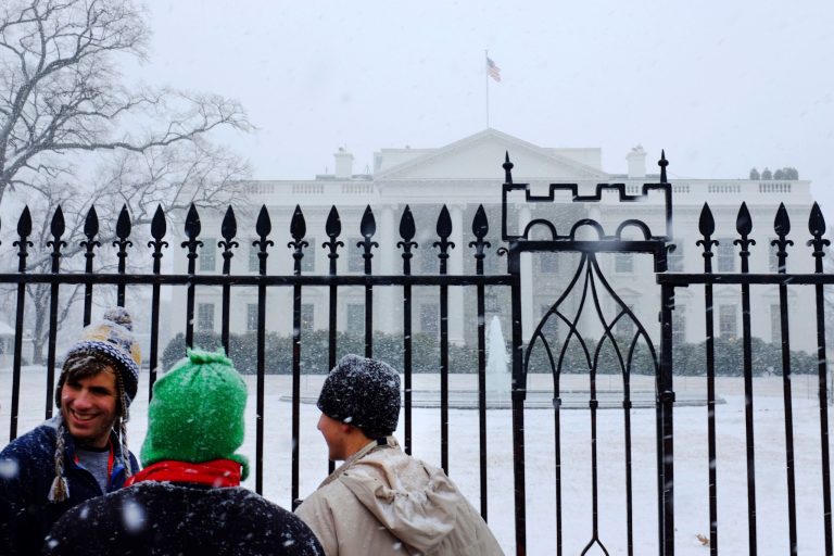 Washington's federal government offices closed Tuesday, and may well close Wednesday, due to snow.ÃÂ Government workers still get paid. In the rest of the country, work goes on as usual.ÃÂ (AP Photo/Jacquelyn Martin)