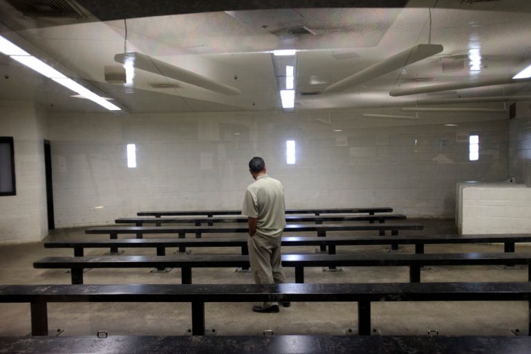In this Jan. 11, 2012, file photo, a man waits to be processed at a Border Patrol detention center in Imperial Beach, Calif. AP Photo/Gregory Bull, File)