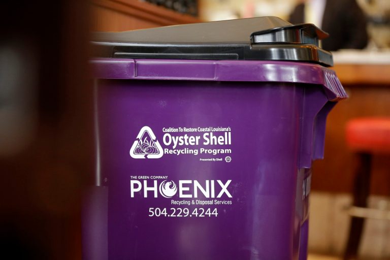 An oyster wheel recycling bin is seen after a news conference at the Bourbon House restaurant in New Orleans, Tuesday, June 24, 2014.  Oyster harvests in south Louisiana are still in recovery since the 2010 BP oil spill. For the second year in a row, restaurants and seafood industry officials are working together to recycle oyster shells to help rebuild oyster beds impacted by the spill. The program, organized by the Coalition to Restore Coastal Louisiana, is aimed at helping New Orleans area restaurants recycle oyster shells. The shells will be returned to coastal waters to help revitalize public oyster seed areas and as material in coastal restoration projects. (AP Photo/Gerald Herbert)