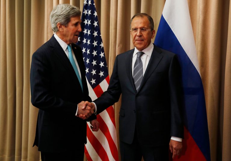 U.S. Secretary of State John Kerry, left, shakes hands with Russian Foreign Minister Sergey Lavrov for a bilateral meeting to discuss the ongoing situation in Ukraine as diplomats from the U.S., Ukraine, Russia and the European Union gather for discussions in Geneva on Thursday. (AP Photo/Jim Bourg, Pool)