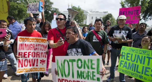Tomas Martinez, of Atlanta, Ga., chants during a rally in front of the White House in Washington, Wednesday, July 24, 2013, calling for of immigration reform. Demonstrators are urging President Barack Obama to use executive authority to expand the policy that allowed hundreds of thousands of illegal immigrants who came to the United States as children to remain. (AP Photo/Evan Vucci)
