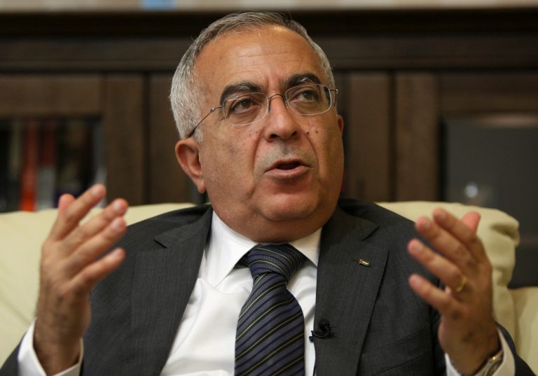 FILE - In this Tuesday, June 28, 2011 file photo, Palestinian Prime Minister Salaam Fayyad speaks during an interview with The Associated Press in the West Bank city of Ramallah. Palestinian officials say Fayyad has officially submitted his resignation, and is waiting for a reply from President Mahmoud Abbas.(AP Photo/Majdi Mohammed, File)