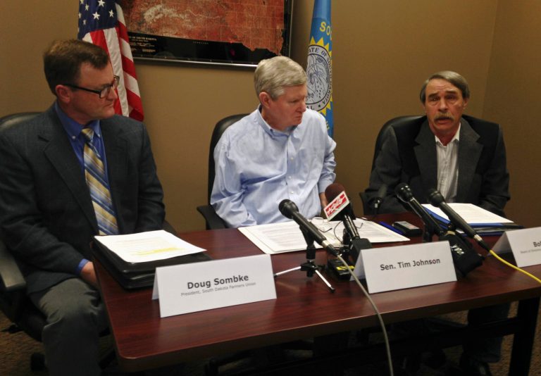 Bob Mack, right, with the South Dakota Stockgrowers Association talks about the pending farm bill in Congress on Tuesday, Jan. 21, 2014, during a news conference in Sioux Falls, S.D. Joining Mack are Doug Sombke, left, with the South Dakota Farmers Union and U.S. Sen. Tim Johnson, D-S.D. (AP Photo/Carson Walker)