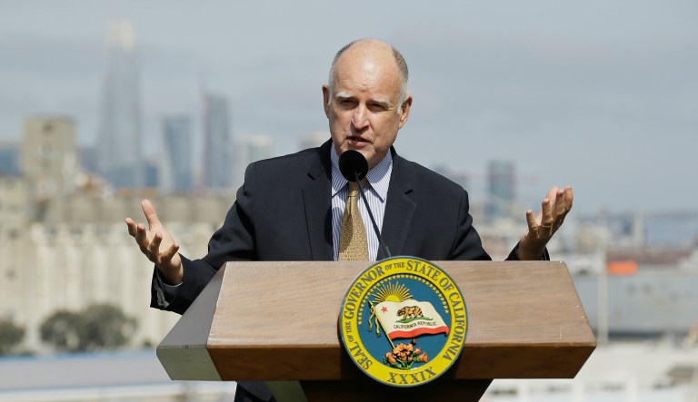California Gov. Jerry Brown is one of the targets of a Justice Department lawsuit aimed at abolishing three state laws the DOJ says obstruct the enforcement of federal immigration law. (AP Photo/Eric Risberg)