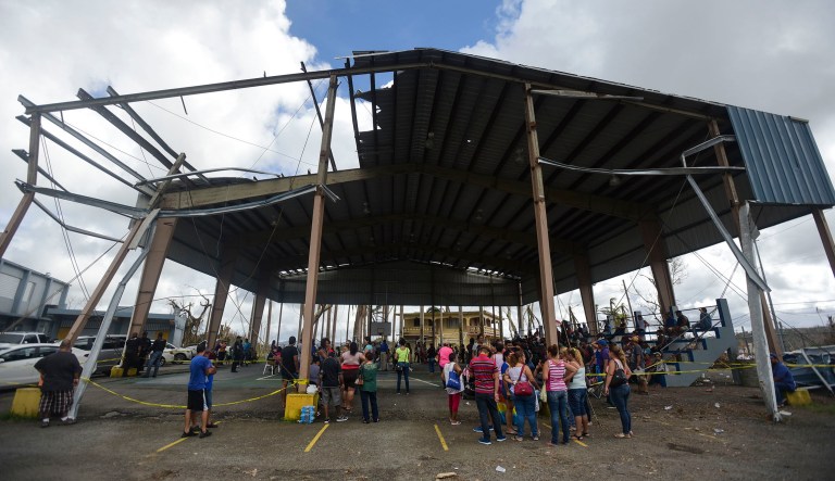 People arrive at the Jose de Diego Elementary School to file FEMA forms for federal aid in the aftermath of Hurricane Maria in Las Piedras, Puerto Rico, Monday, Oct. 2, 2017. (AP Photo/Carlos Giusti)