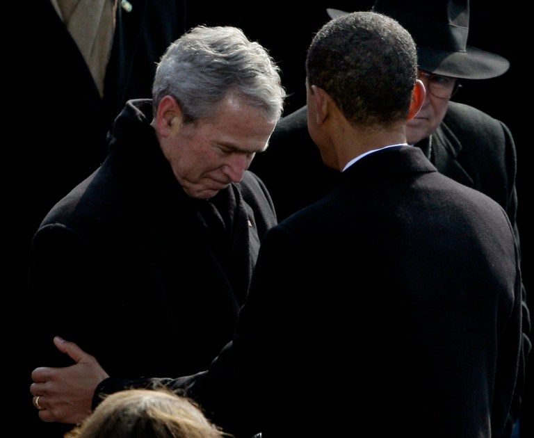 President Barack Obama talks to former President George W. Bush as former Vice President Dick Cheney, right, looks on, after Obama delivered his inaugural address at the U.S. Capitol in Washington, Tuesday, Jan. 20, 2009.(AP Photo/Jeff Christensen)