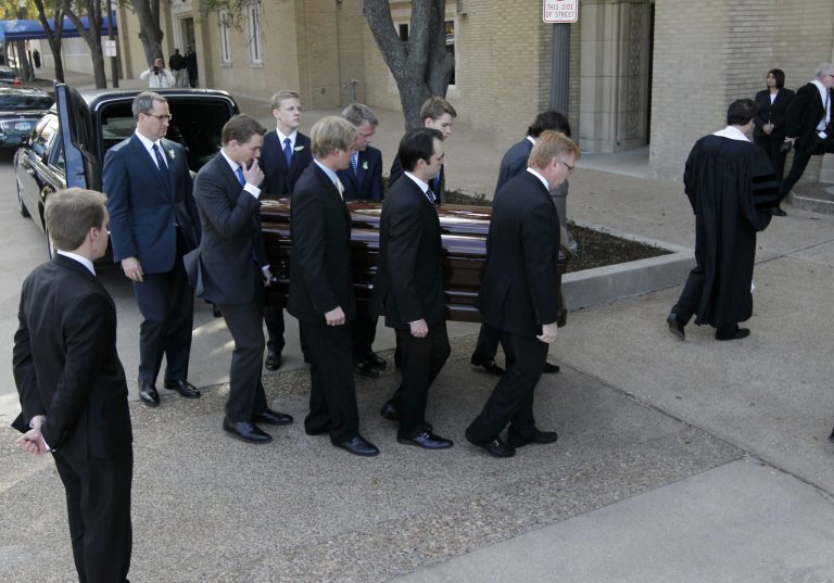 Pallbearers carry Van Cliburn's coffin into Broadway Baptist Church for a funeral service for in Fort Worth, Texas on Sunday, March 3, 2013. The internationally famous musician died this week. About 1,400 people attended a memorial service for Cliburn, who died Wednesday at 78 after fighting bone cancer. As the service began, the Fort Worth Symphony Orchestra accompanied a choir as pall bearers carried his flower-covered coffin into the Fort Worth church. (AP Photo/Star-Telegram, Ron T. Ennis, Pool)