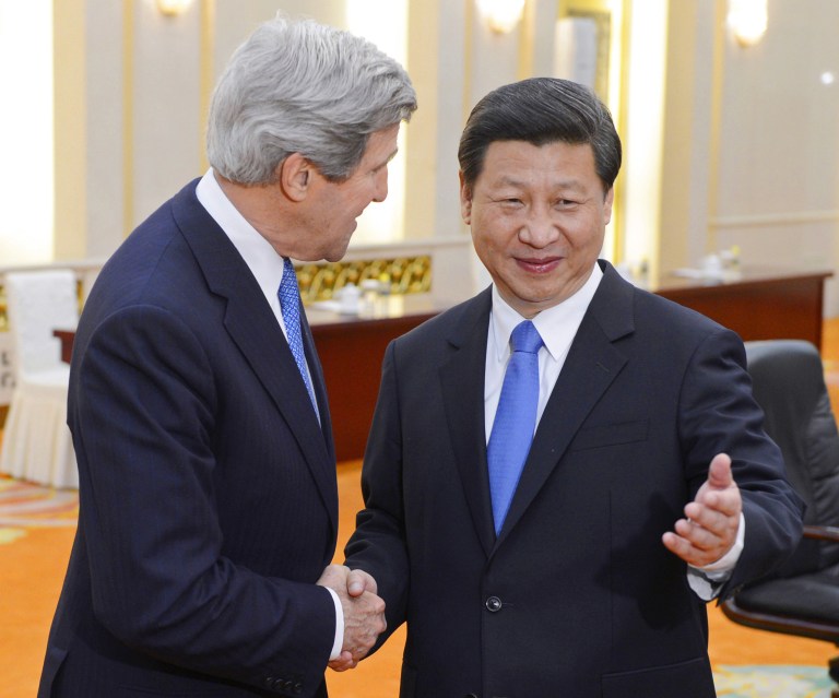 Chinese President Xi Jinping, right, poses with U.S. Secretary of State John Kerry before their meeting at the Great Hall of the People in Beijing Saturday, April 13, 2013. The question of how Washington can persuade Beijing to exert real pressure on North Korean leader Kim Jong Un's unpredictable regime is front and center as Kerry meets Saturday with Chinese leaders in Beijing. (AP Photo/Yohsuke Mizuno, Pool)