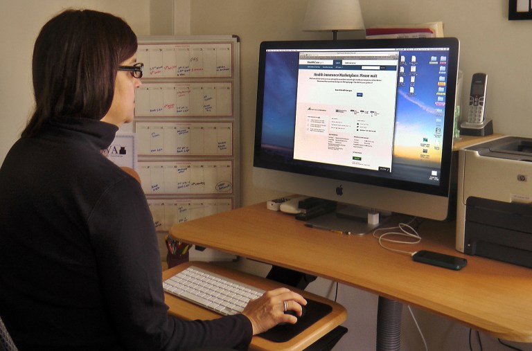 Deborah Lielasus, 54, tries to sign up for health care coverage Tuesday in Portsmouth, N.H. (AP/Holly Ramer)