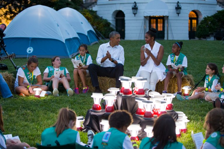President Barack Obama and first lady Michelle Obama talk with Girl Scouts during a Lets Move! event on the South Lawn of the White House, on Tuesday, June 30, 2015, in Washington. Fifty fourth-grade Girl Scouts from councils in Maryland, West Virginia, Virginia, the District of Columbia and Oklahoma have been invited to spend the night sleeping in tents pitched on the South Lawn. (AP Photo/Evan Vucci)