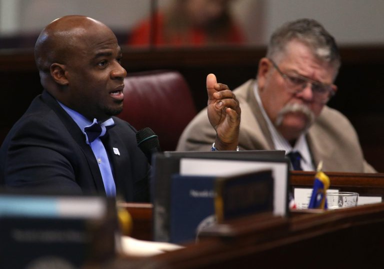 Nevada Sen. Kelvin Atkinson, D-North Las Vegas, asks questions of economic experts during the second day of a special session at the Nevada Legislature, Thursday, Sept. 11, 2014,  in Carson City, Nev.  Lawmakers are  considering an unprecedented package of up to $1.3 billion in incentives to bring Tesla Motors' $5 billion battery factory to the state.  (AP Photo/Cathleen Allison)