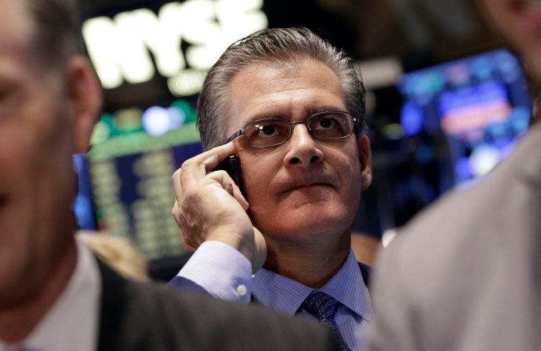 Trader Richard Devicarro works on the floor of the New York Stock Exchange, Friday, Oct. 10, 2014. Major U.S. stock indexes got off to an uneven start in early trading Friday, a day after stocks clocked their worst day of the year. (AP Photo/Richard Drew)