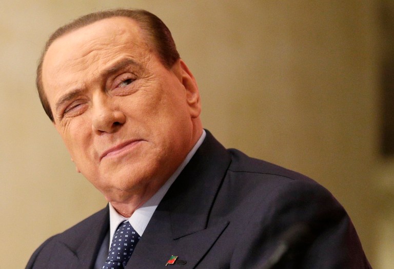 FILE - In this Dec. 4, 2013 file photo Silvio Berlusconi attends the launch of a book 