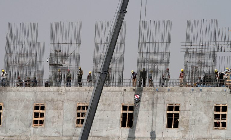 Afghan construction workers install steel reinforcement bars on a building to be used by the Afghan National Army in Kabul, Afghanistan, Tuesday, Oct. 8, 2013. The site is just one of many construction projects in the capital, where skilled workers earn about $20 per day and laborers earn around $10 daily. (AP Photo/Rahmat Gul)