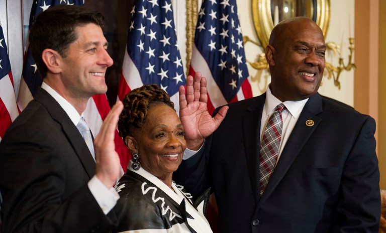 House Speaker Paul Ryan of Wis., left, conducts a ceremonial swearing-in Monday for Rep.-elect Dwight Evans, D-Pa. center, as his mother Jean Evans, center, participates. (AP Photo/Cliff Owen)