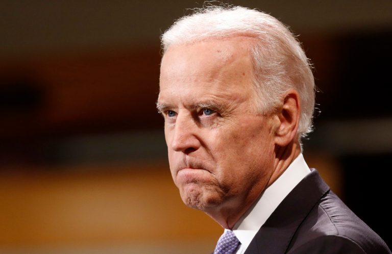 Vice President Joe Biden bites his lip while speaking to students faculty and staff at Harvard University's Kennedy School of Government in Cambridge, Mass. Thursday, Oct. 2, 2014. (AP Photo/Winslow Townson)