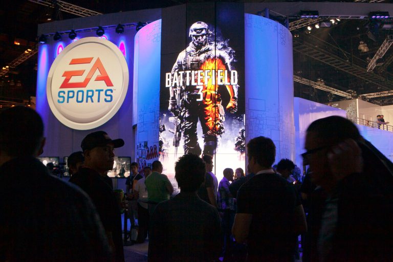 Attendees line up at the Electronic Arts booth to play the new 